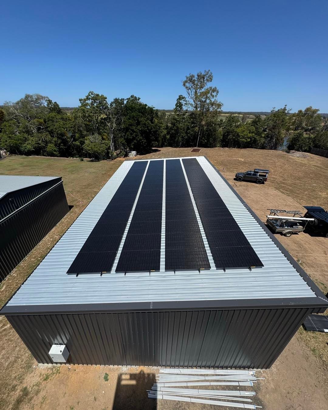 Solar Panels on Corrugated Metal Roof of a Building — Pearson Electrical Solar and Airconditioning in Bundaberg Central, QLD