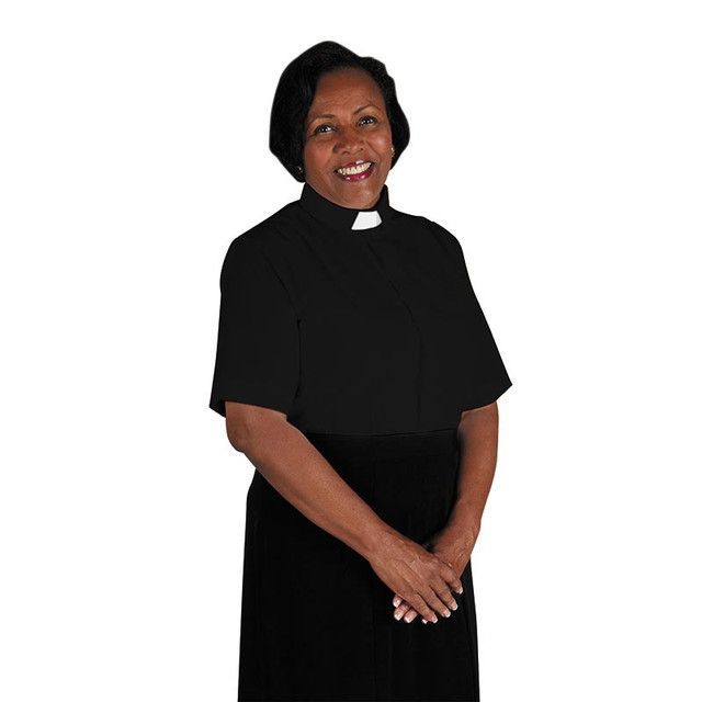 An Image of a woman wearing short sleeve clergy shirt/tab collar at Saving Grace Christian Bookstore