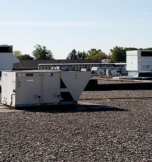 A rooftop with a lot of air conditioners on it
