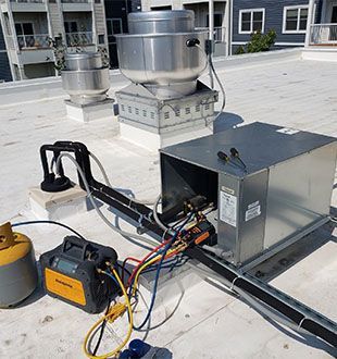 A rooftop with a bunch of wires connected to it