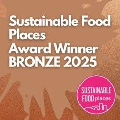 A pink circle with the words sustainable food places on it