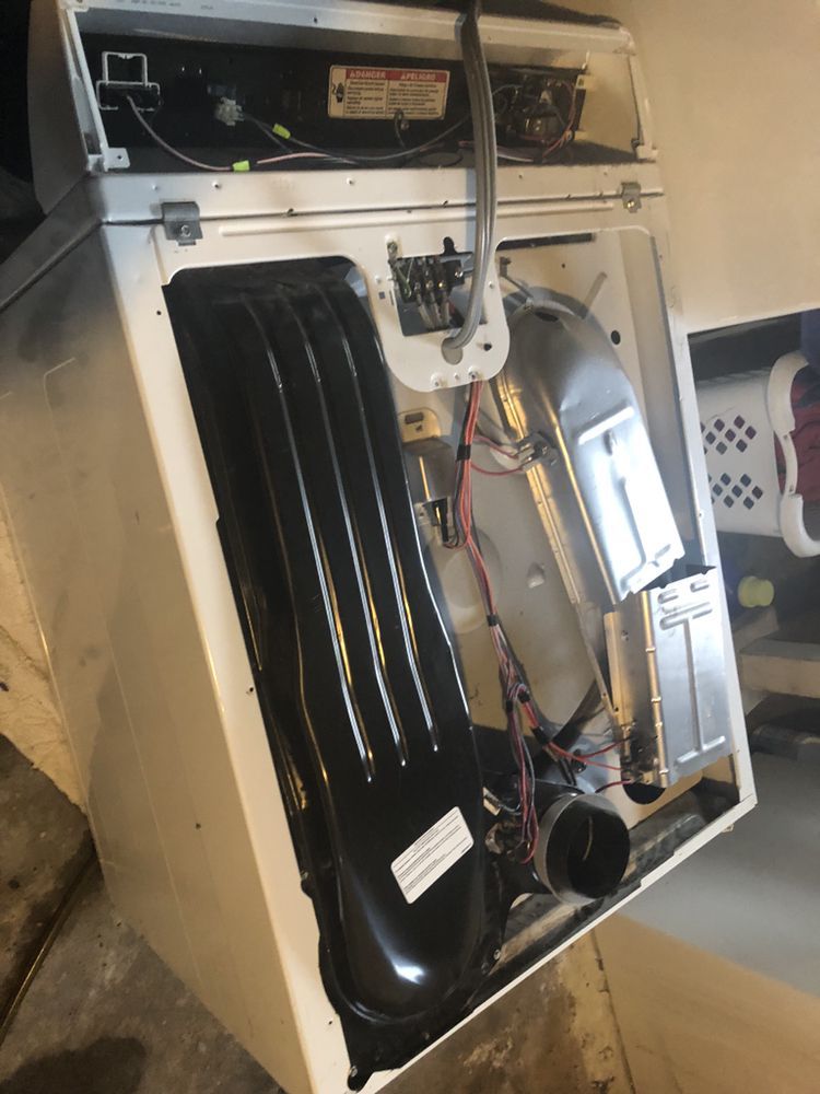 the inside of a washing machine is shown with the door open .