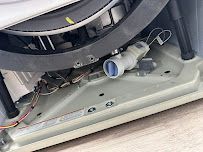 a close up of the underside of a washing machine .