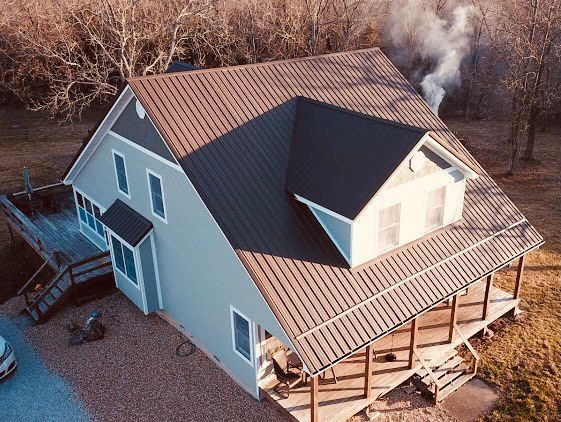 black metal roof in sunlight on home