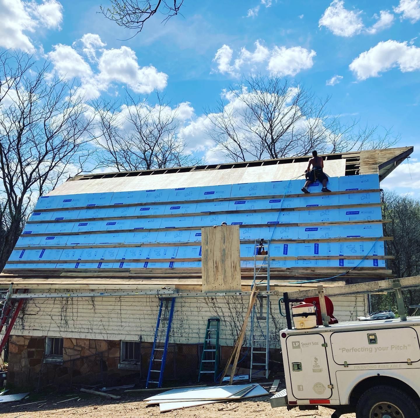 In-progress metal roof installation