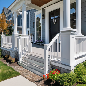 the front porch of a house with a white railing