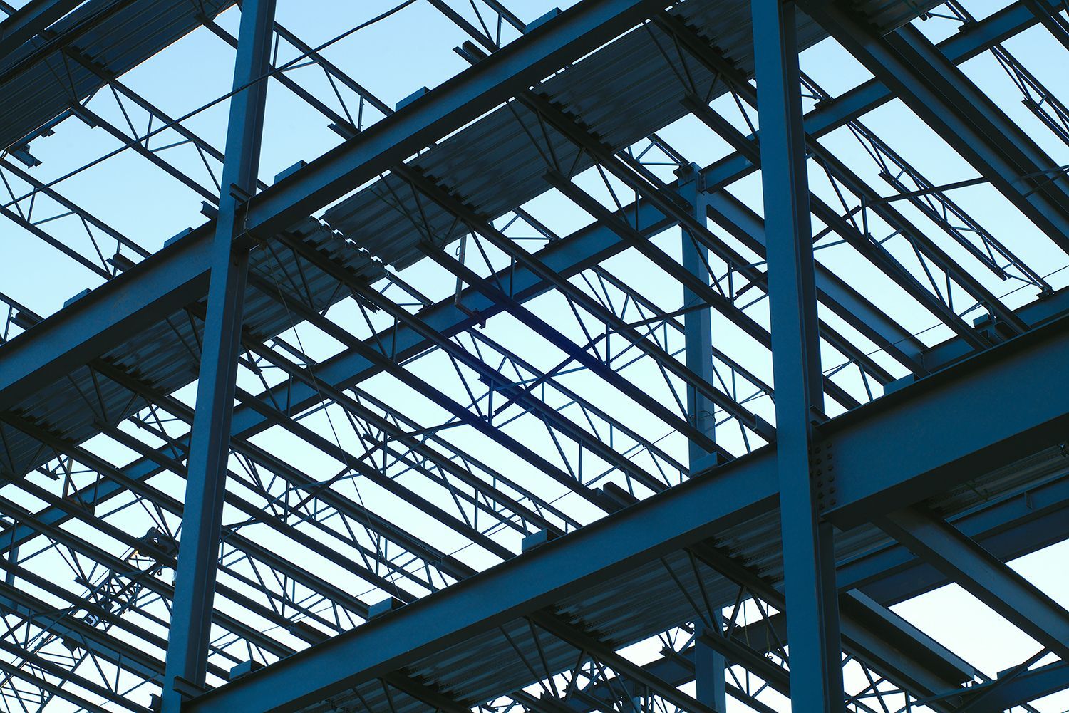 Metal building construction with exposed steel framework and structural beams. Metal building construction with exposed steel framework and structural beams.