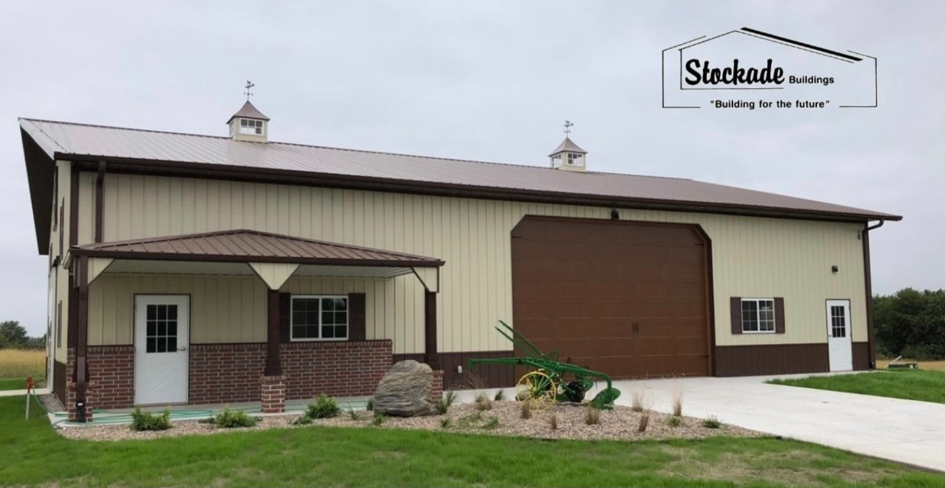 A large brick building with a brown roof and black windows