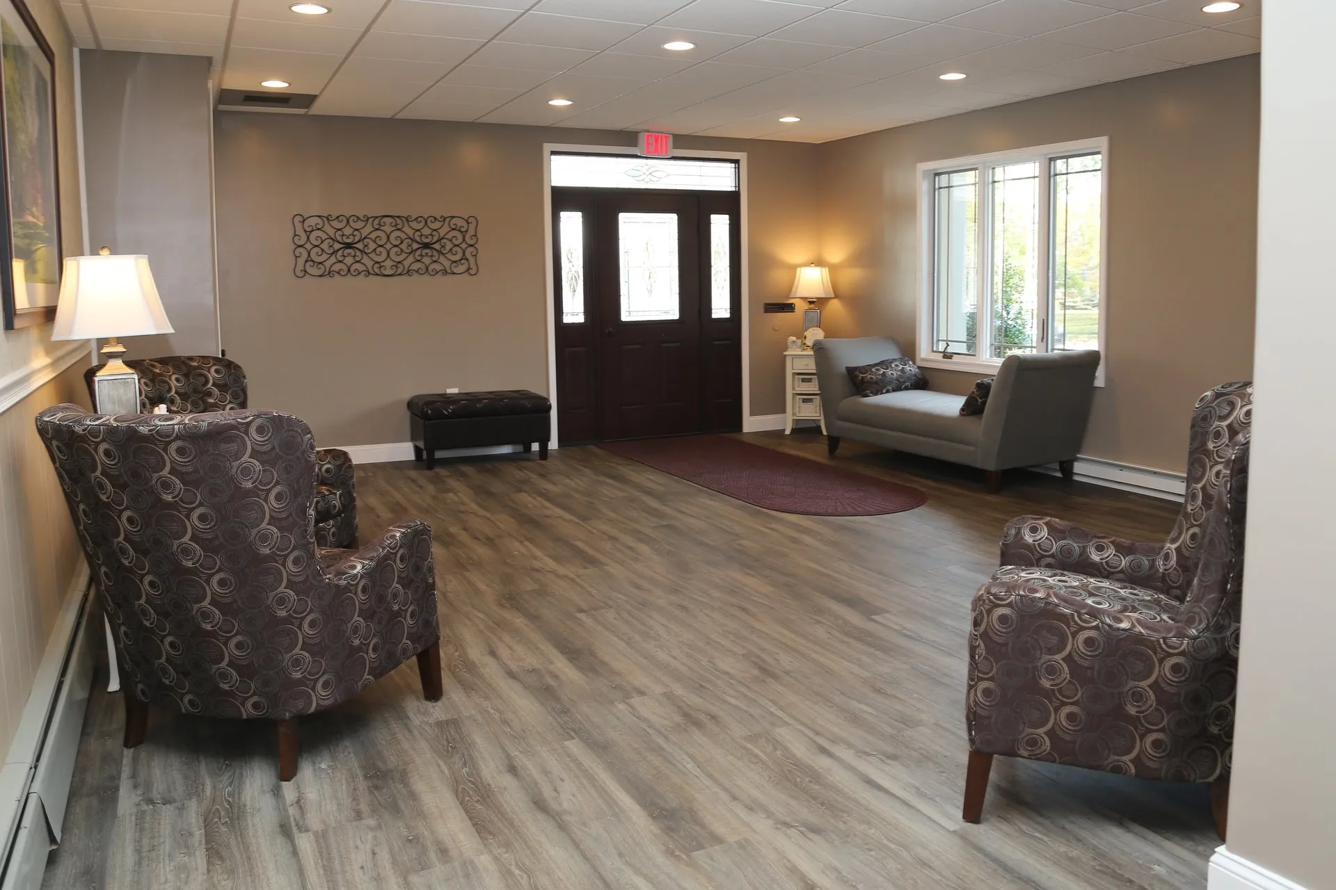 funeral home facilities room with chairs and sofa