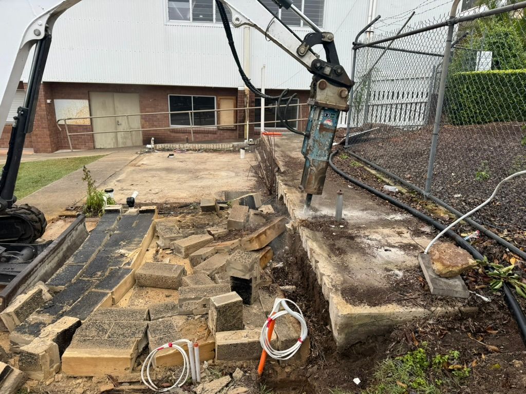 A Man is Working on a Piece of Wood in a Factory — Tomac Civil In Burleigh Heads, QLD
