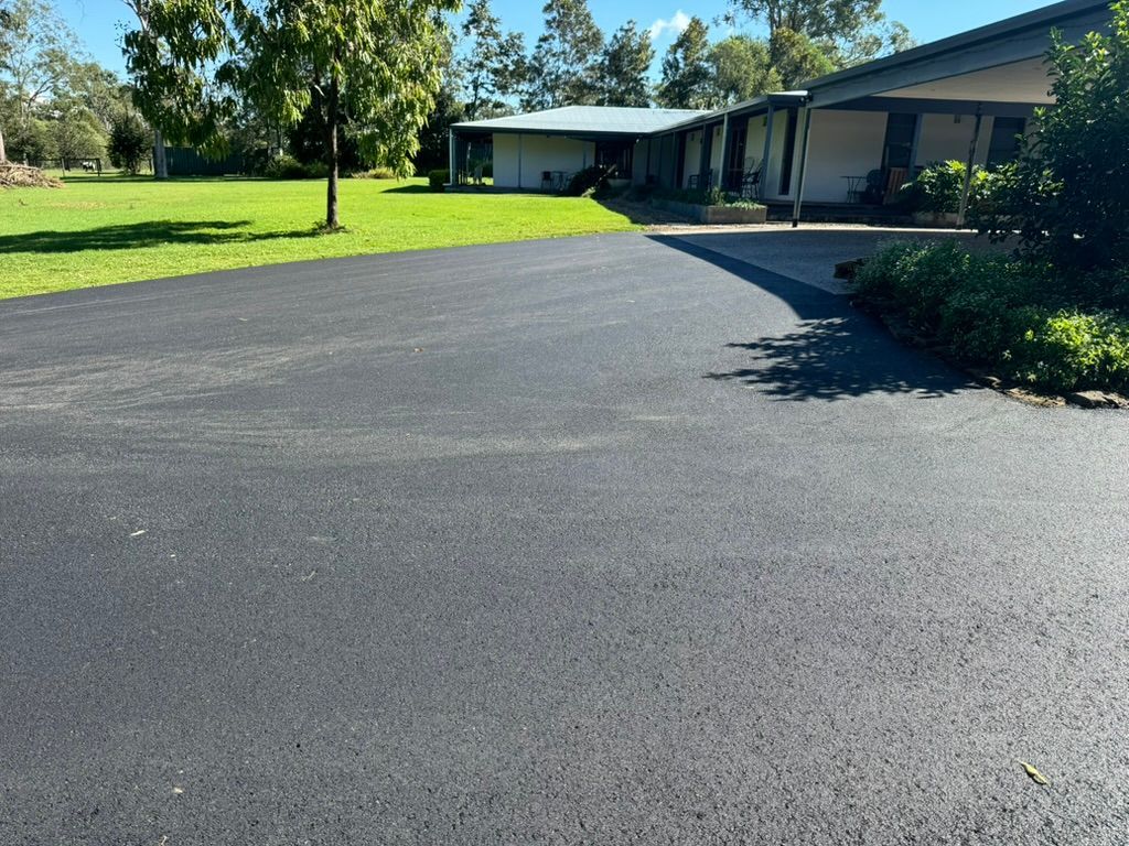 Asphalt Driveway Curves Toward a House — Asphalt & Concreting Services & Solutions on the Gold Coast, QLD