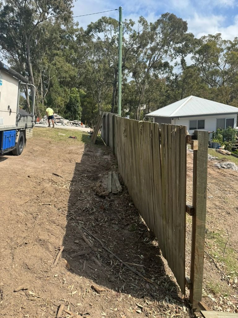 Wooden Fence Along a Dirt Path — Asphalt & Concreting Services & Solutions in Logan Village, QLD
