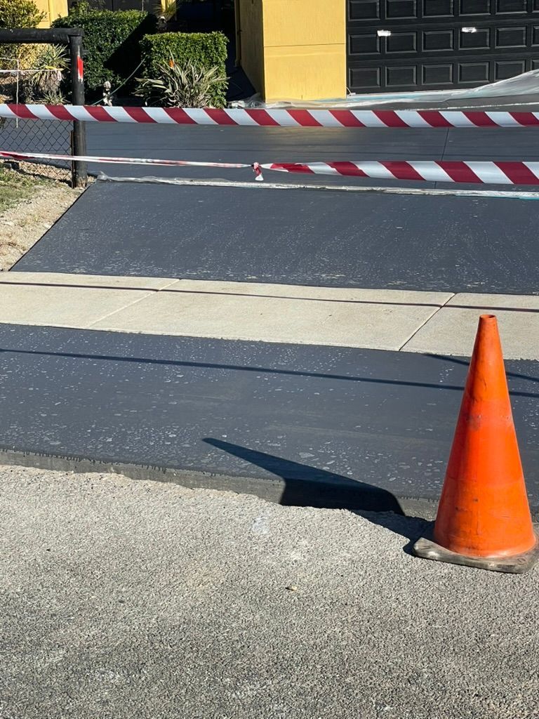 Freshly Paved Asphalt Driveway — Asphalt & Concreting Services & Solutions in Logan Village, QLD