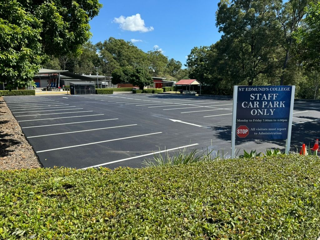Empty Staff Car Park With Sign — Asphalt & Concreting Services & Solutions on the Gold Coast, QLD