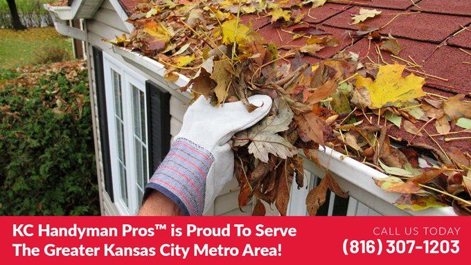 handyman near me in Independence MO clearing leaves from a gutter