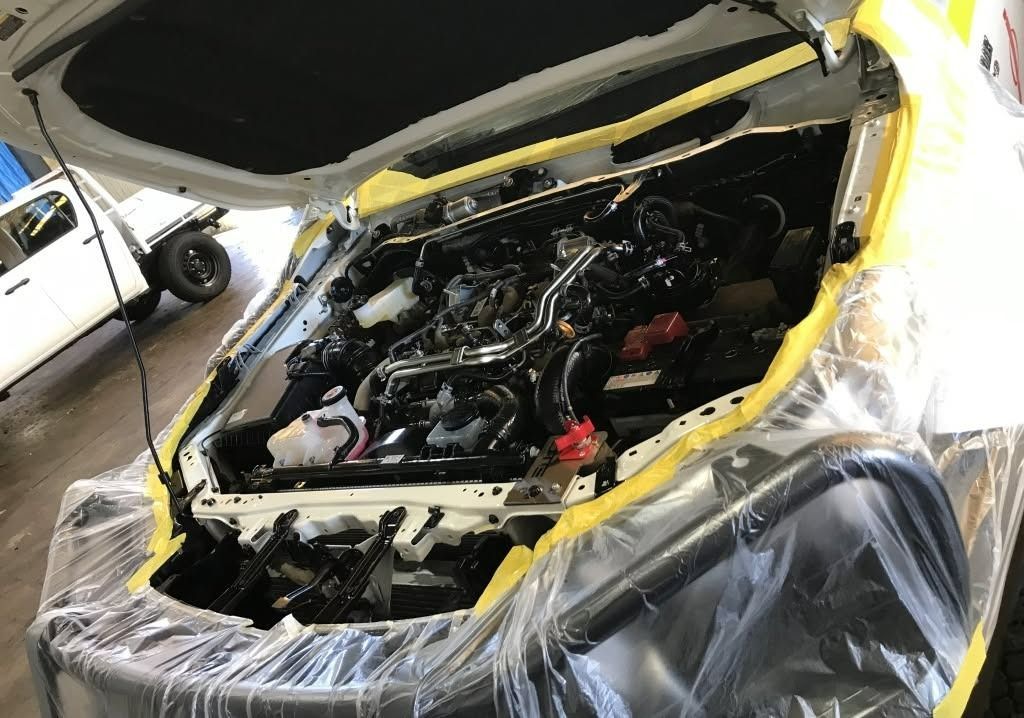 The Hood of a Car is Open and Wrapped in Plastic — Endrust (Coffs Harbour) in Coffs Harbour, NSW