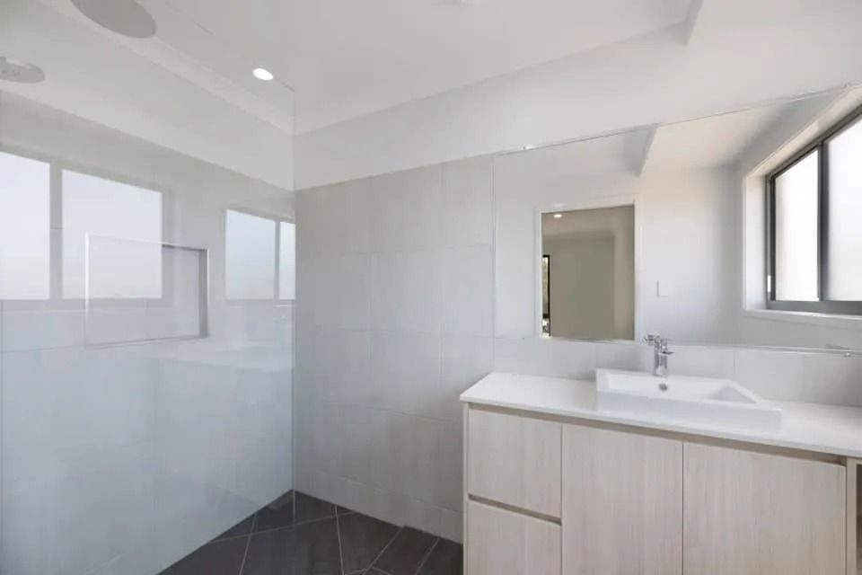 Modern Bathroom with A Walk-In Shower, White Cabinetry — Country to Coast Homes In Gregory River, QLD