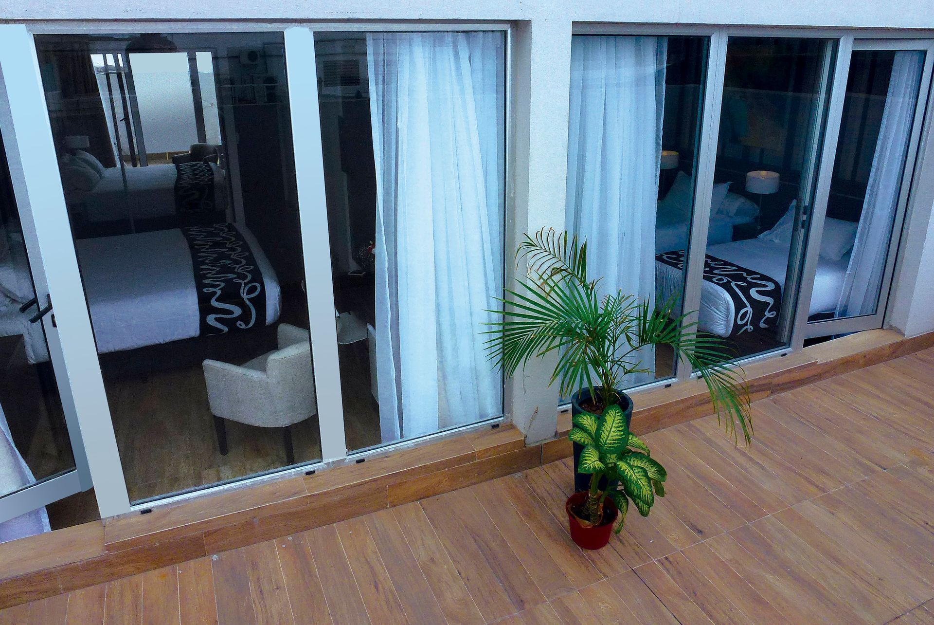 An aerial view of a hotel room with sliding glass doors.