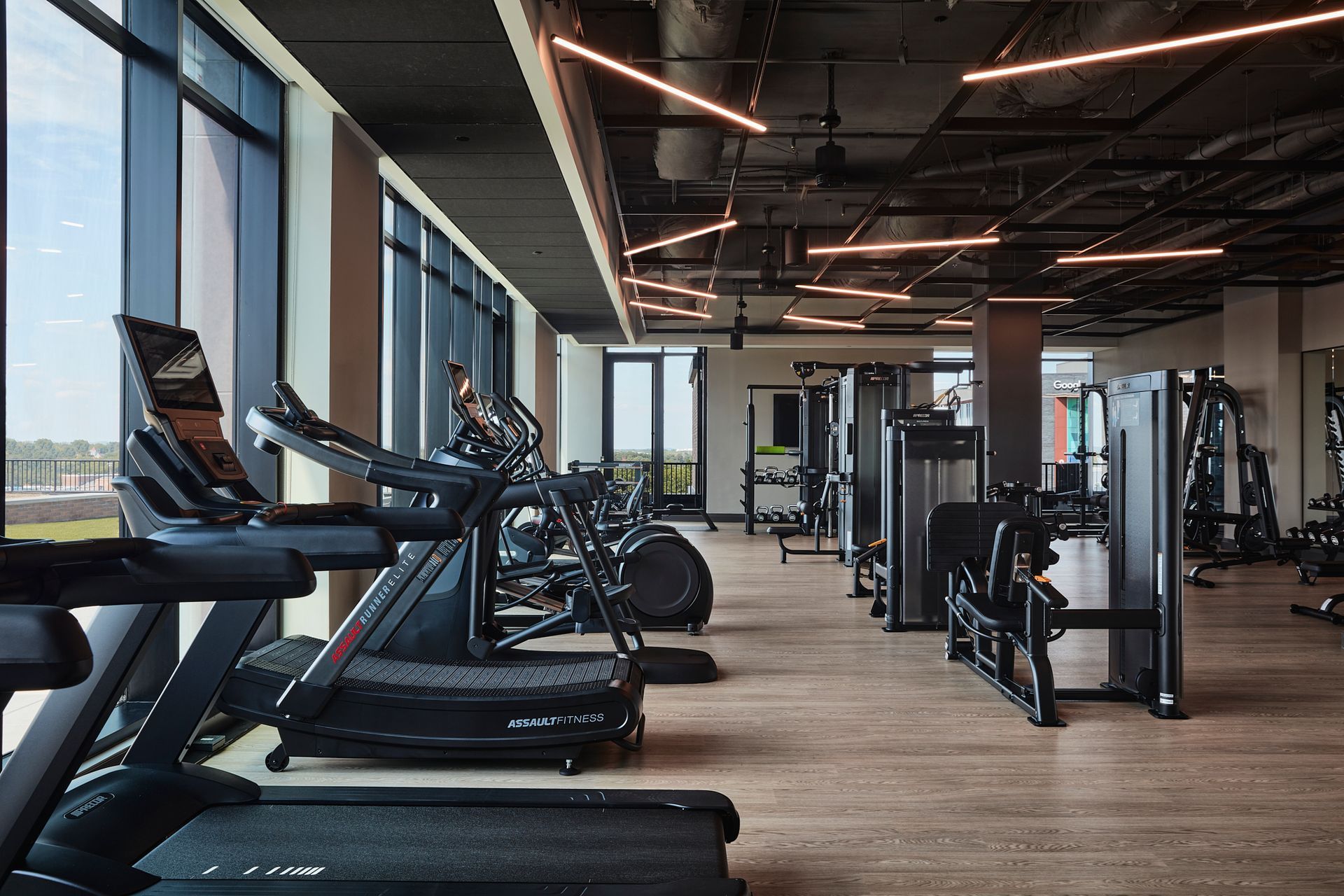 An artist 's impression of a gym with treadmills and exercise bikes
