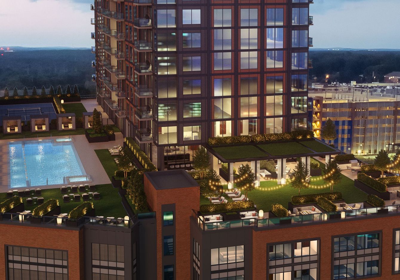 An aerial view of a building with a pool on the roof