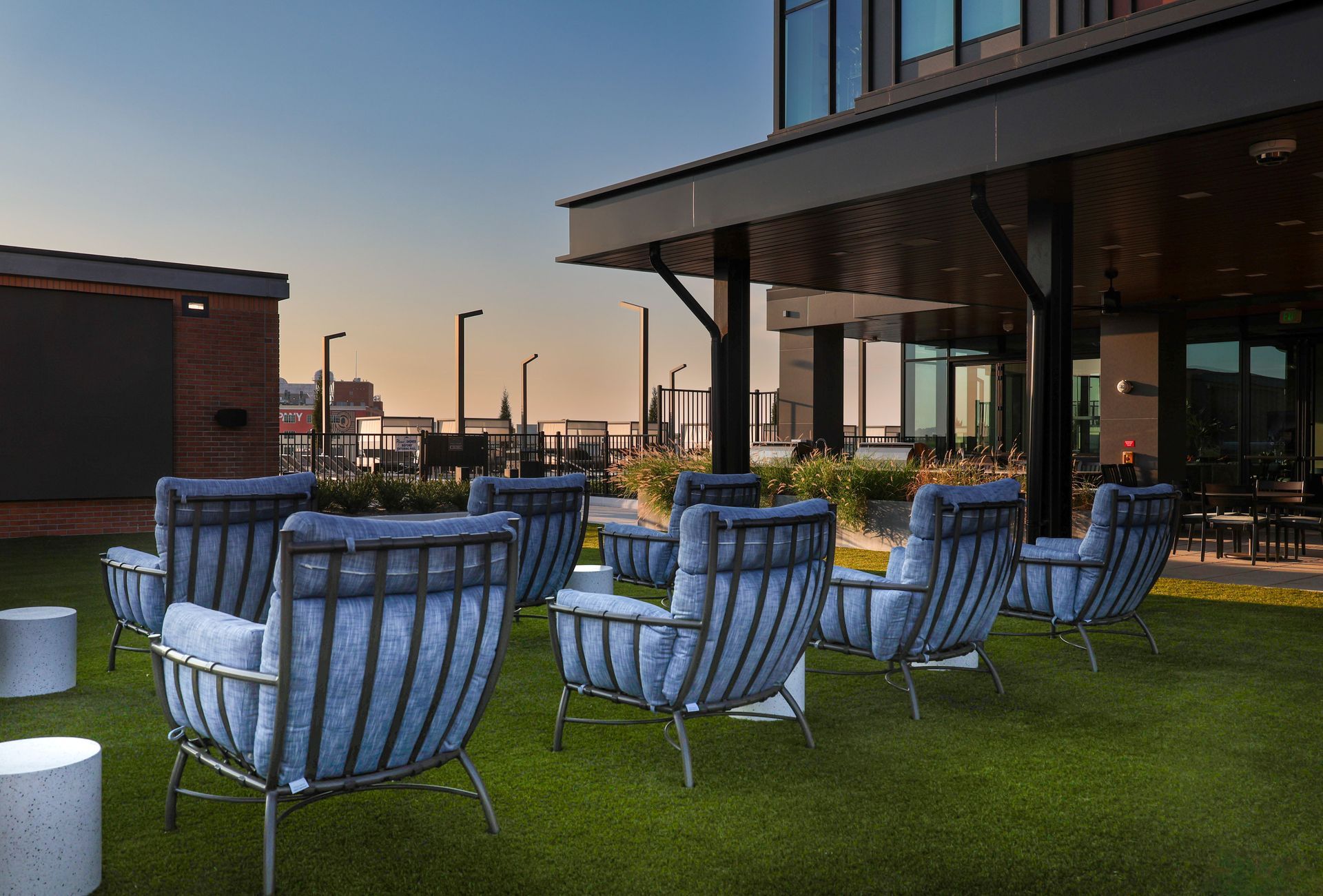 An artist 's impression of a large swimming pool surrounded by lounge chairs