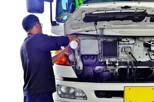 A Man Is Working on The Engine of A Truck β Wyong Radiator Repairs in Tuggerah, NSW