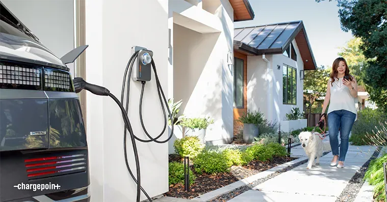 Electrician installing EV charging station on a commercial property in London
