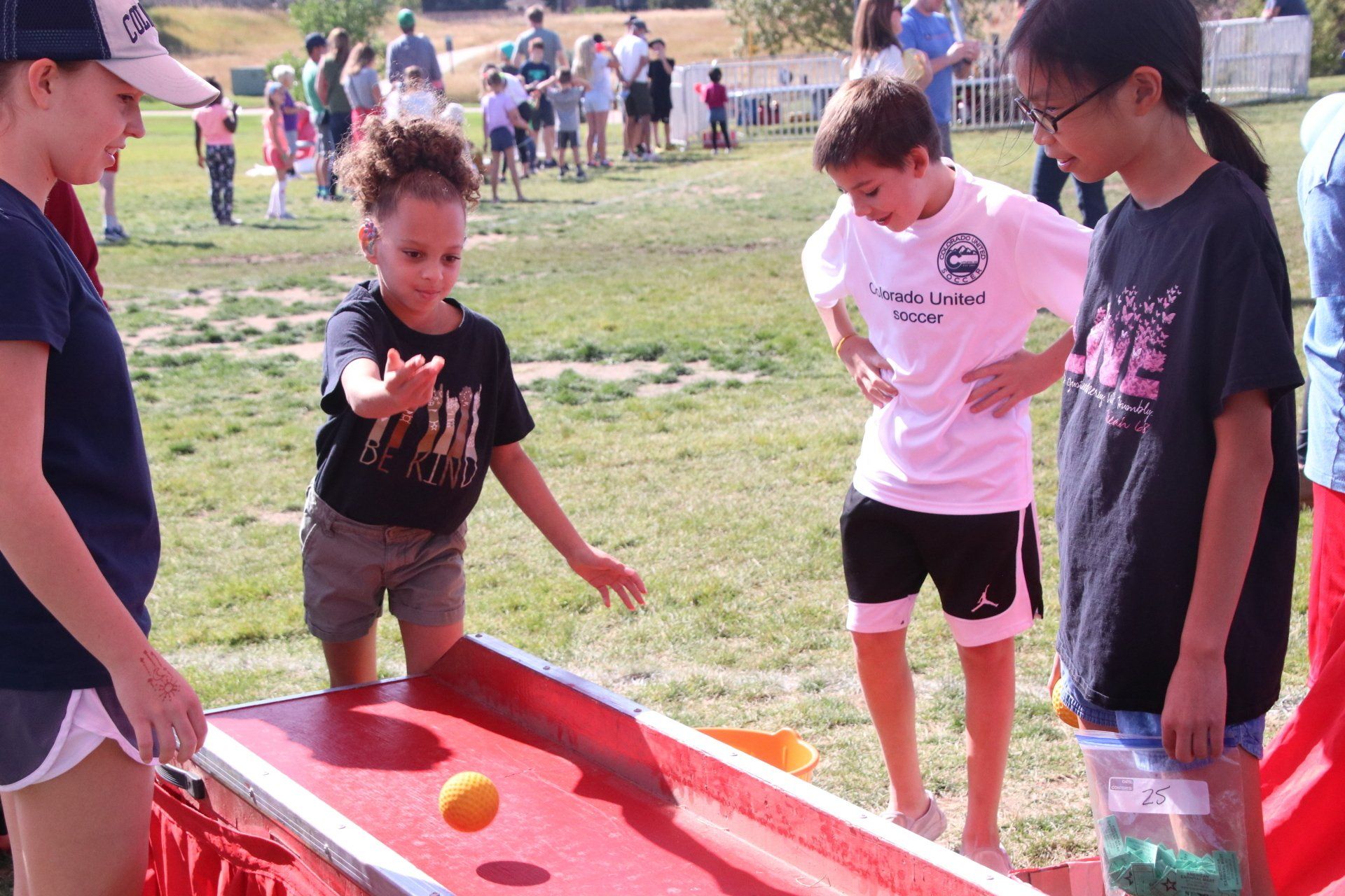 A group of children are playing a game in a park.