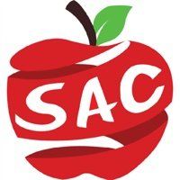 A red apple with the word sac written on it.