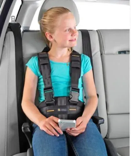A Man Is Sitting in The Driver's Seat of A Car Pulling Seat Belt — Mobility Modification Services In Garbutt, QLD