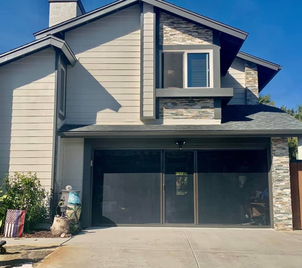 The front of a house with a large garage door