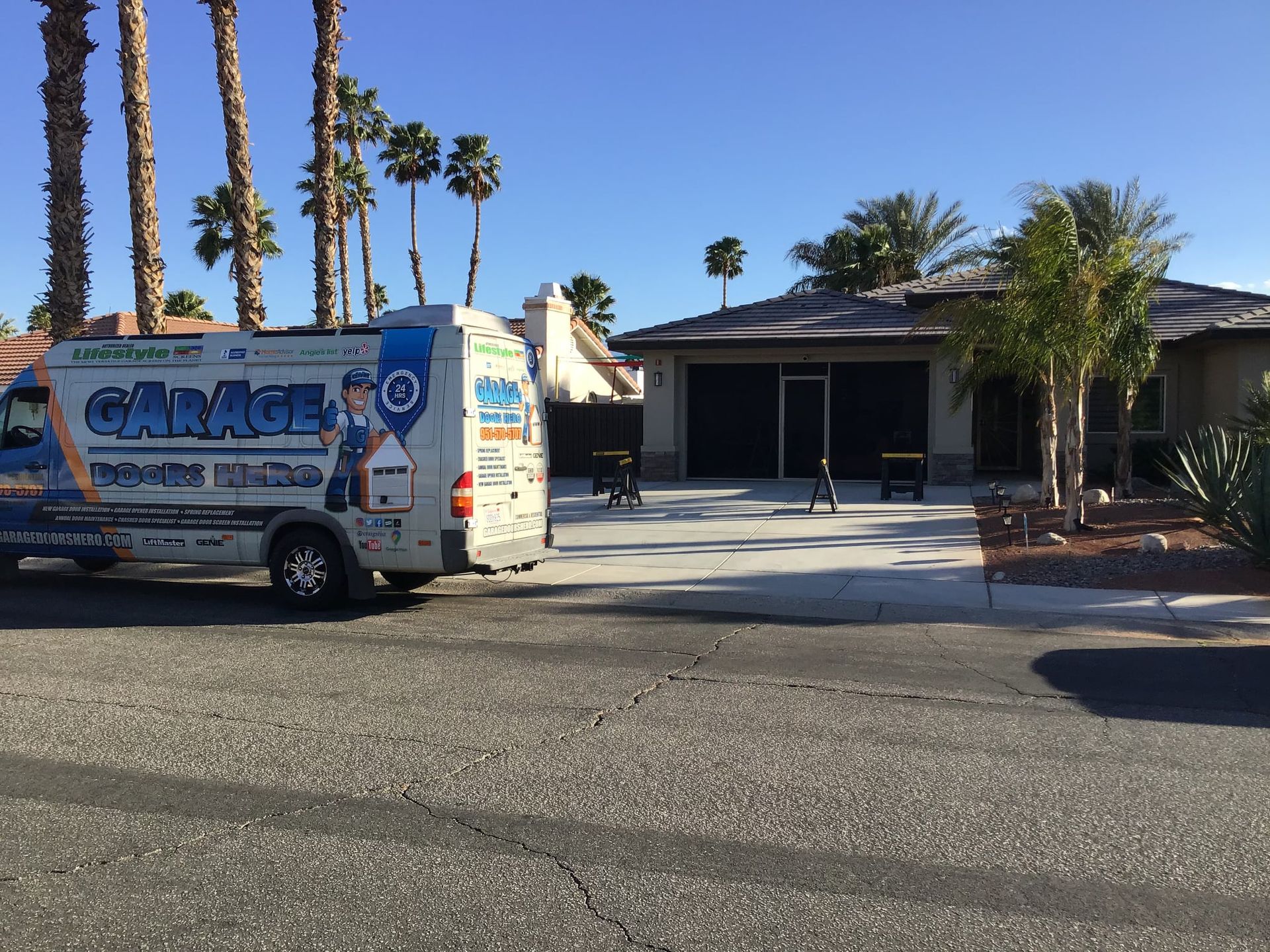 A van that says cancel to is parked in front of a house