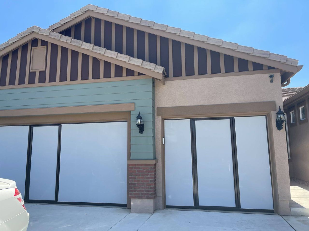 A house with a car parked in front of it