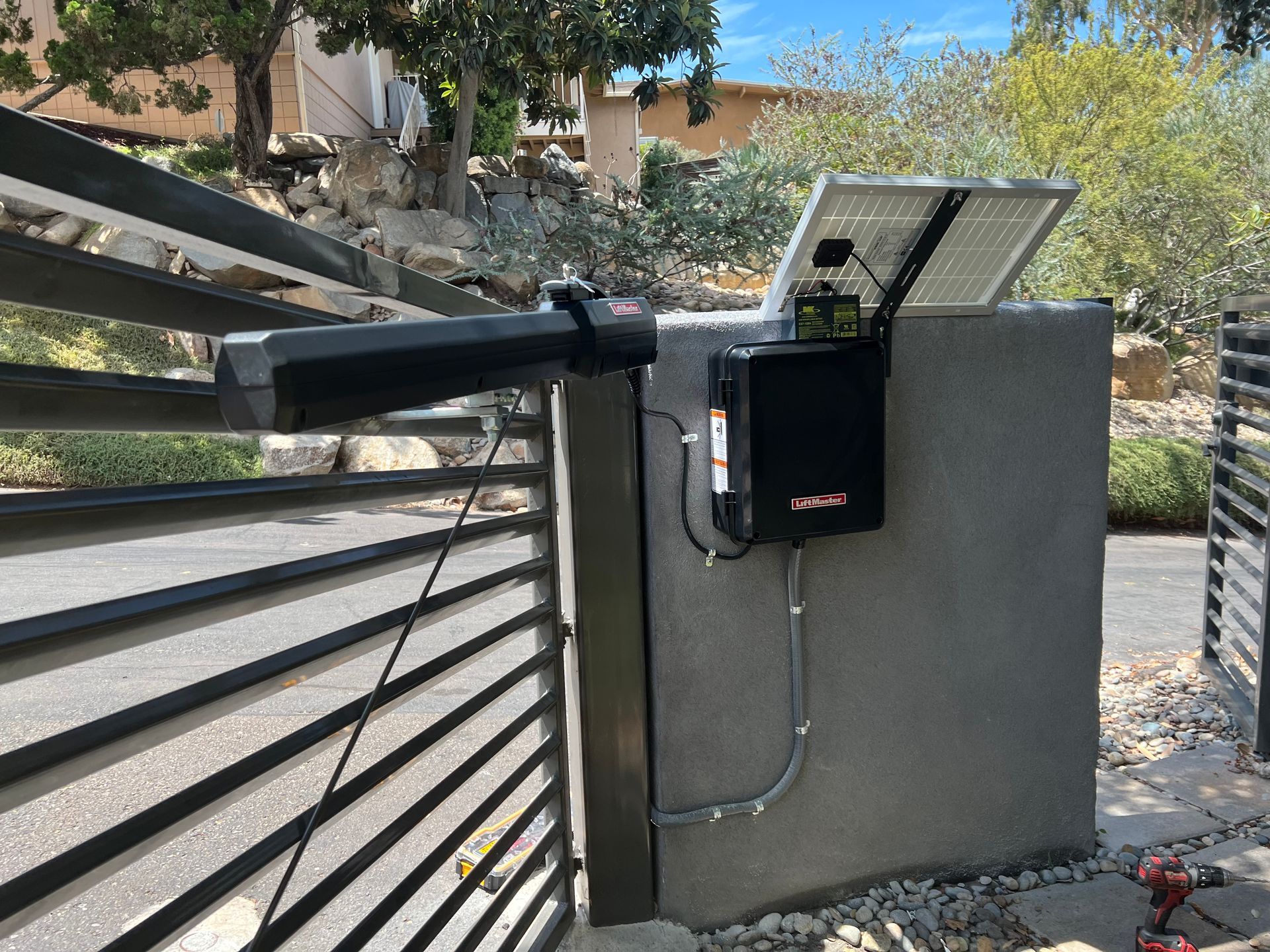 A gate with a solar panel attached to it.