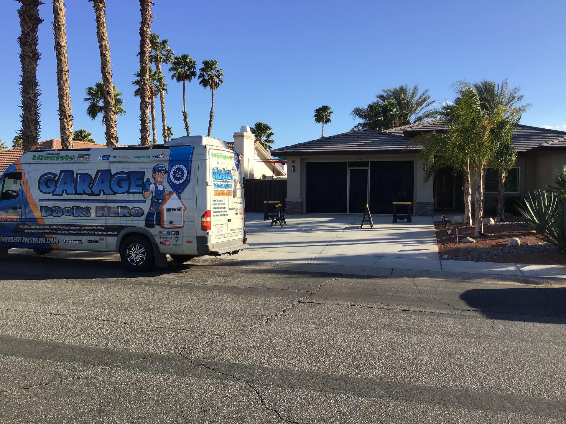 A van with the word cancel on it is parked in front of a house