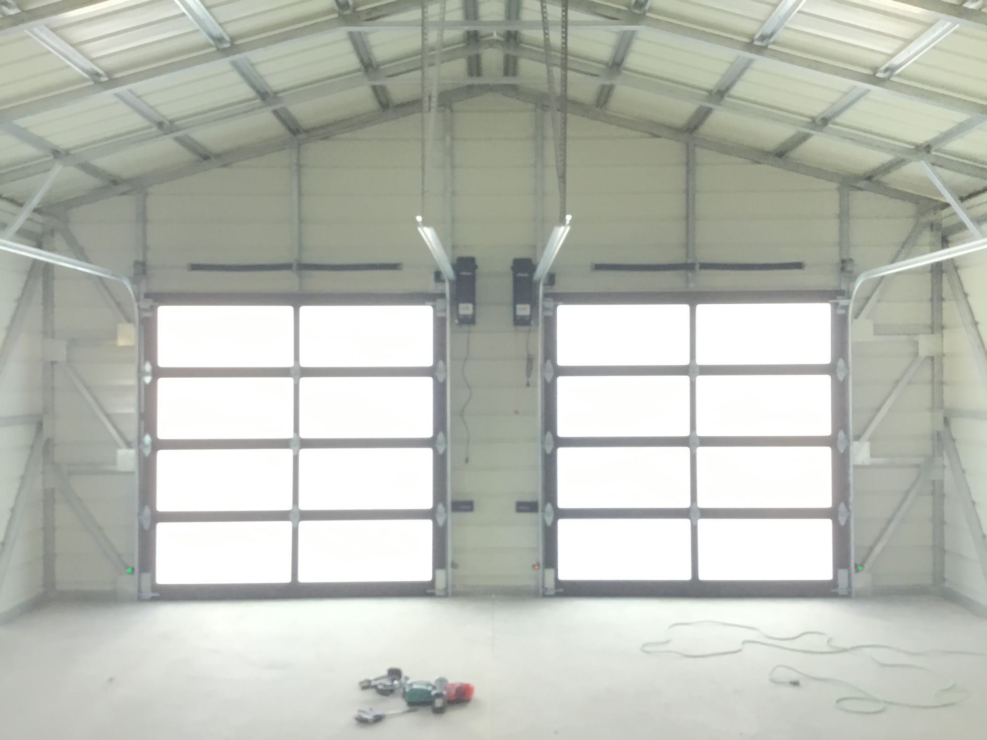 A large empty garage with a lot of windows