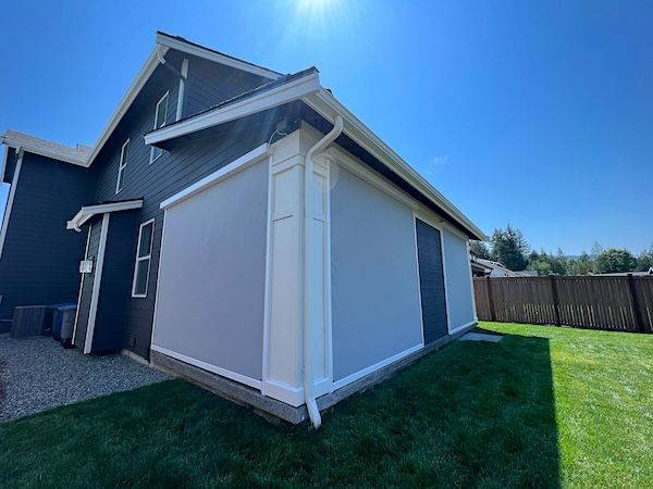 A house with a white Screened garage