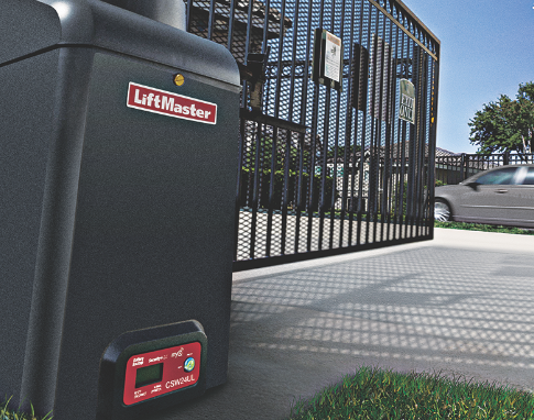 A liftmaster garage door opener is sitting next to a gate