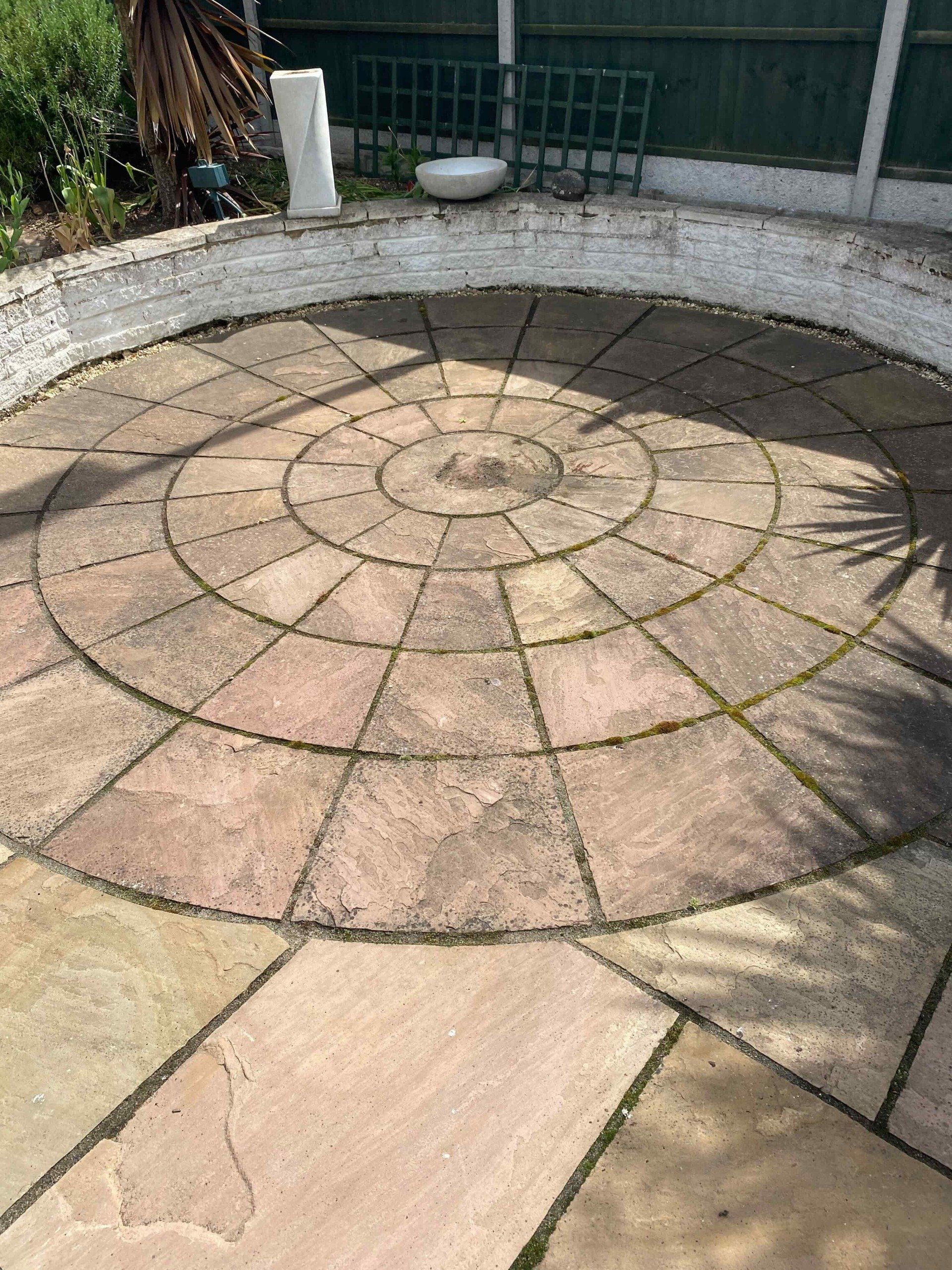 Natural stone patio before cleaning in Harrogate