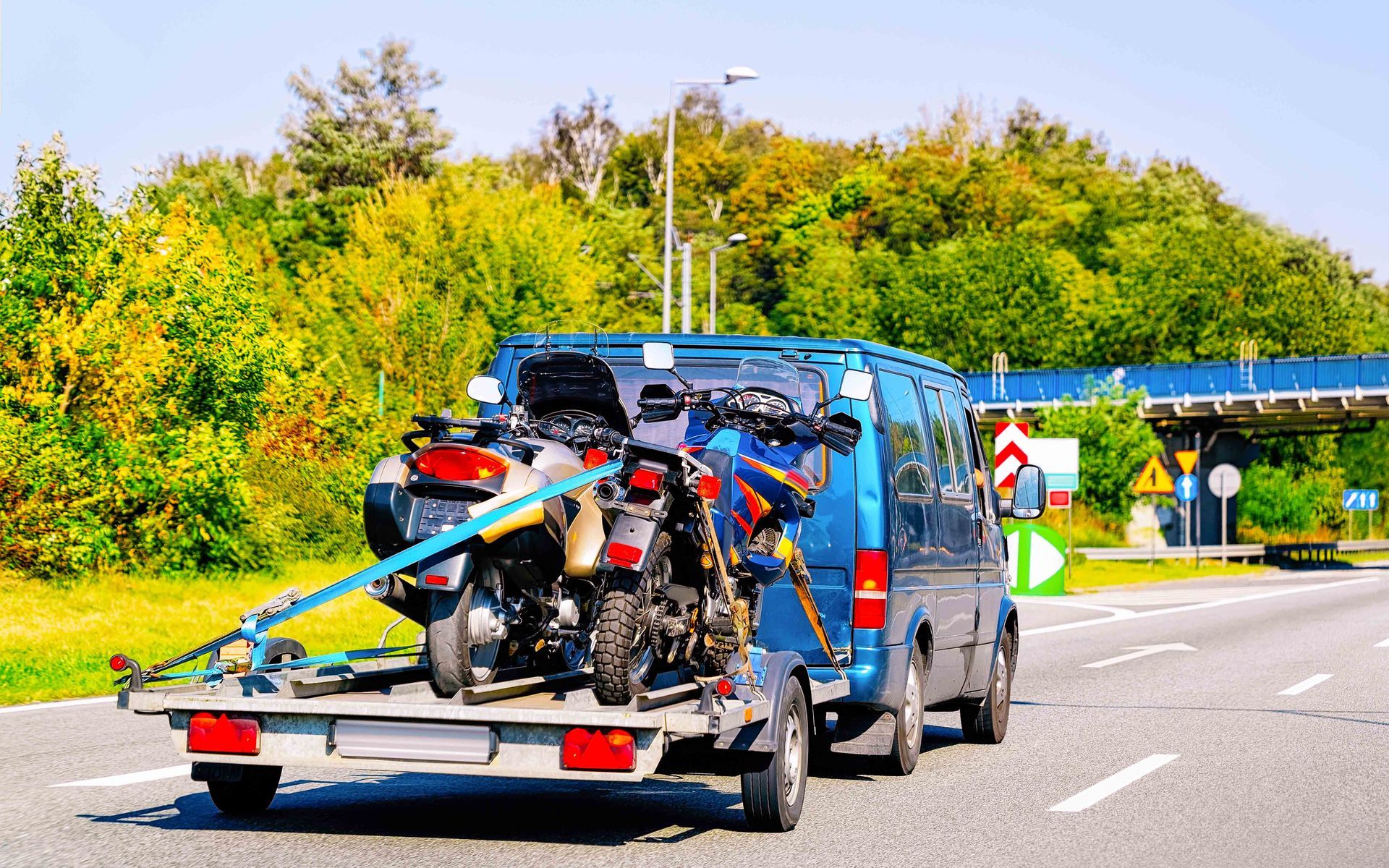 Mini Van With Motorcycles on Trailer — Des Plaines, IL — Schimka Auto Wreckers Inc