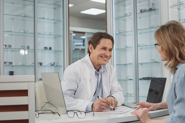 Smiling Staff Talking to a Patient — Binghamton, NY — Binghamton Eye Associates