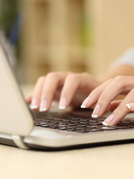 Woman Typing - Carpel Tunnel in Laguna Beach, CA