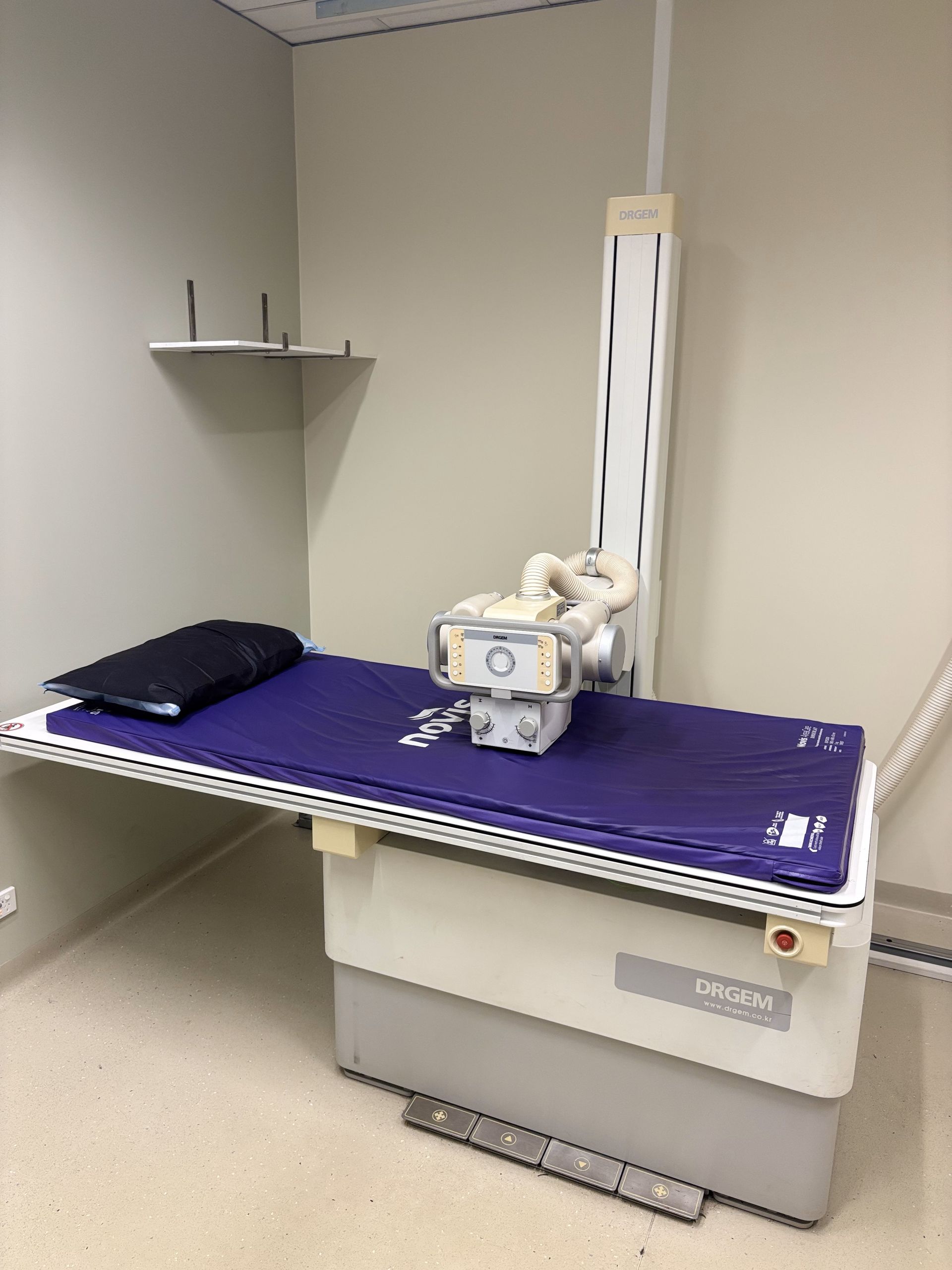 A doctor is looking at a patient 's x-ray on a tablet.