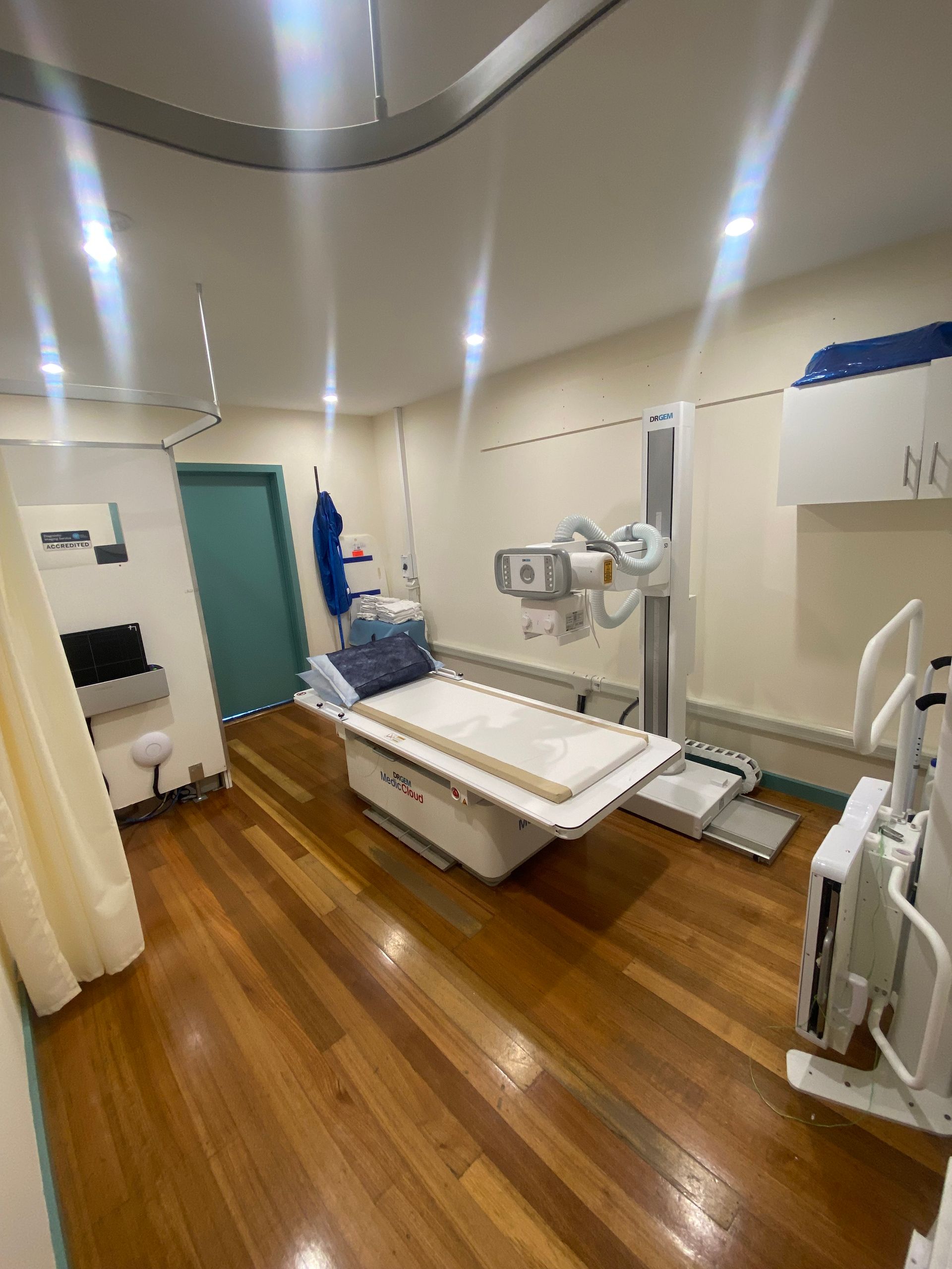 A doctor is holding a tablet with a picture of a brain on it.