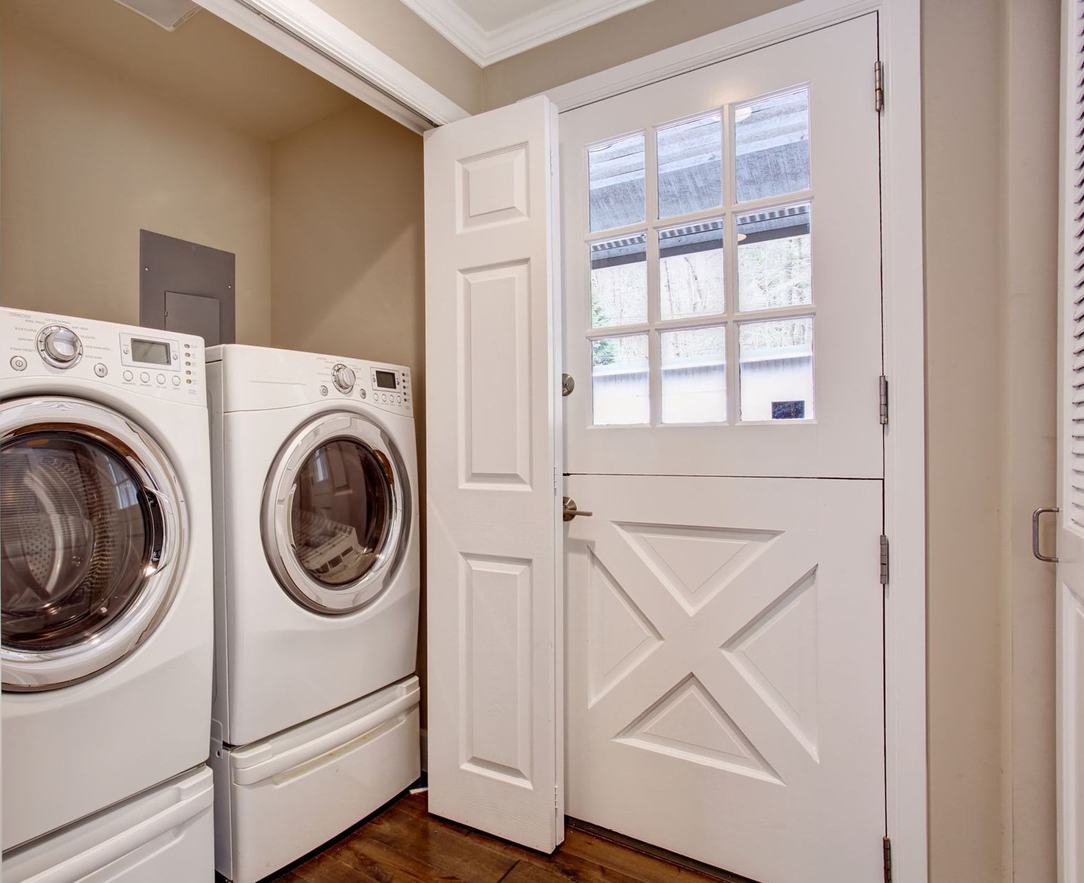 A laundry room with a washer and dryer in it.