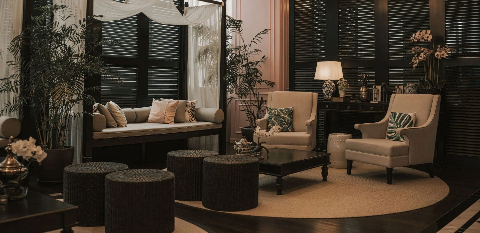 Living room with seating and dark wooden accents.
