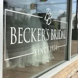 Becker's Bridal store window with logo, dress visible.