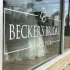 Becker's Bridal store window with logo, dress visible. 