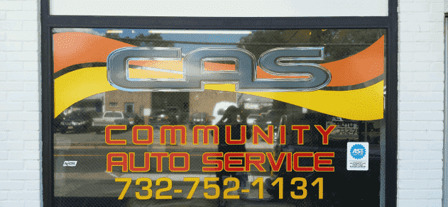 A sign that says community auto service on it