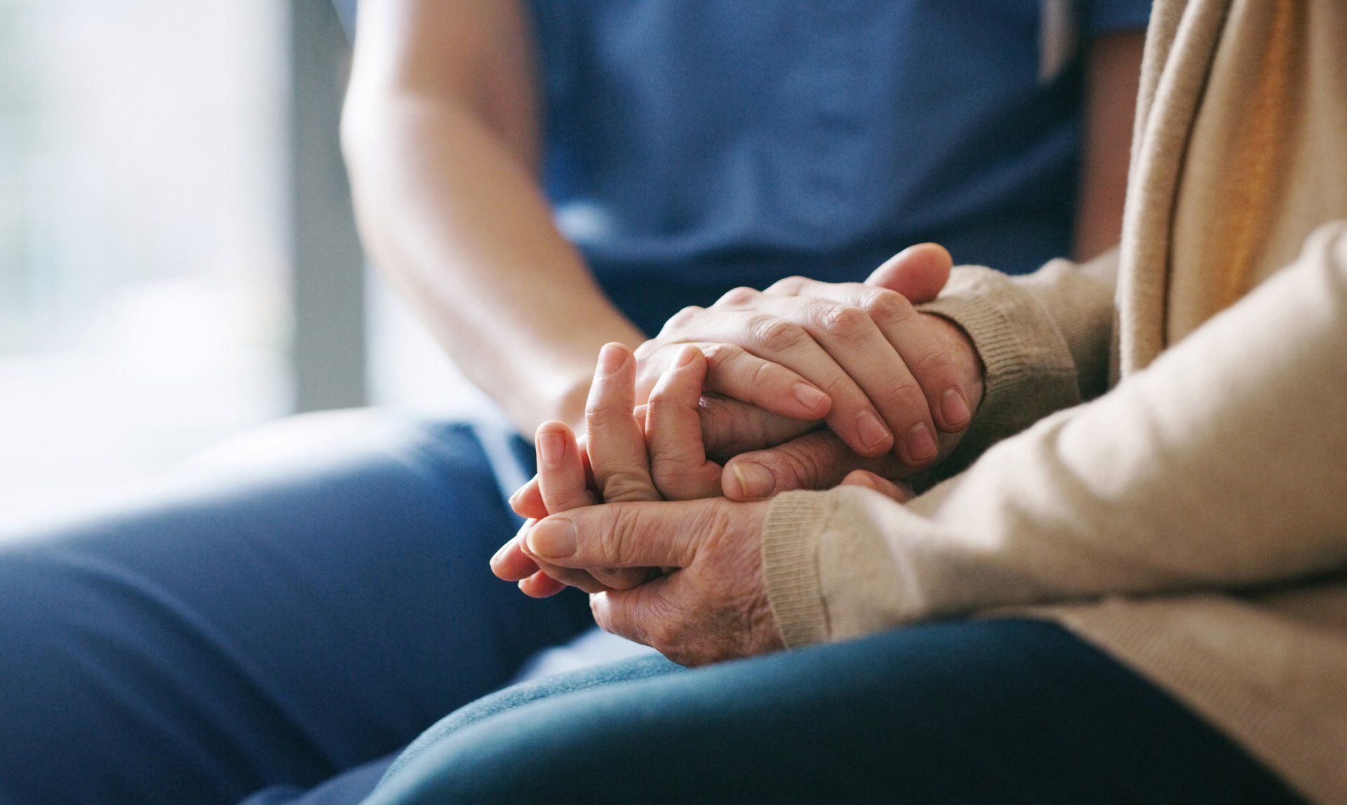 Senior Woman Holding Hands with A Nurse — Corpus Christi, TX — Angel Bright Hospice, Inc.